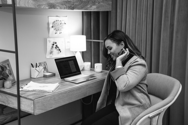 Rossalvi Marte smiling at her desk in her office