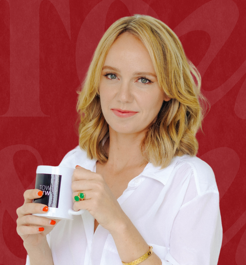 woman headshot holding coffee cup