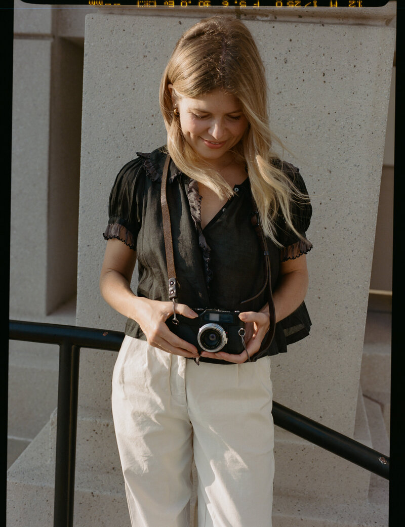 Female fine art photographer in Los Angeles smiling and looking at the camera