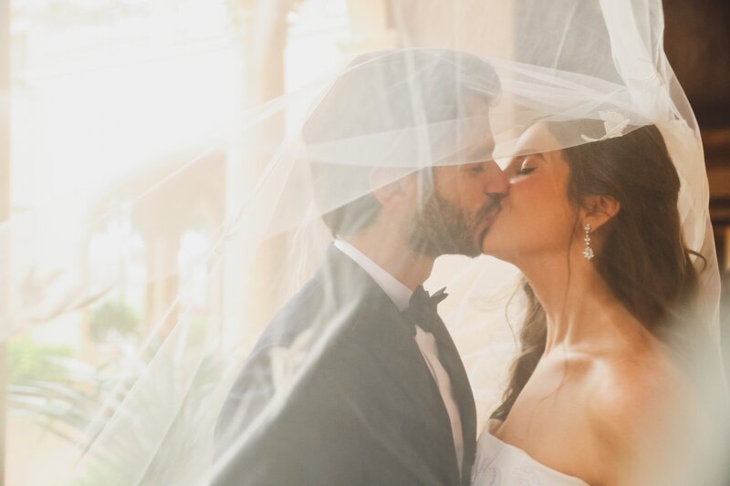 south-florida-bride-groom-kissing-veil