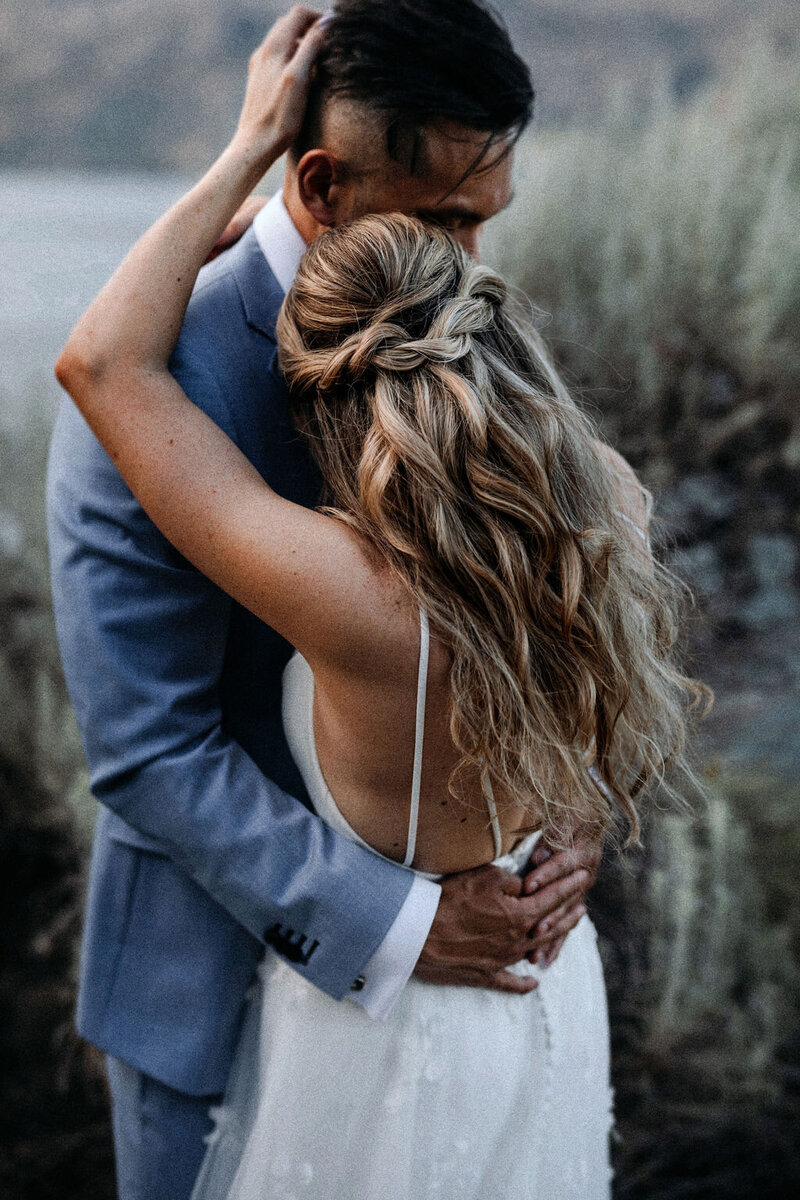 bride and groom embrace