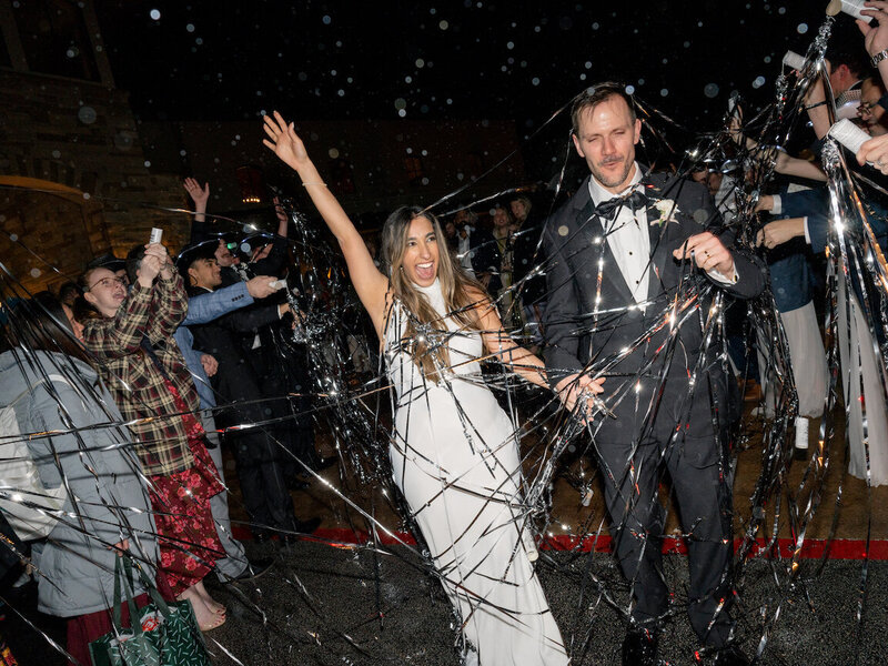 Bride and groom’s grand exit from Canyonwood Ridge reception hall