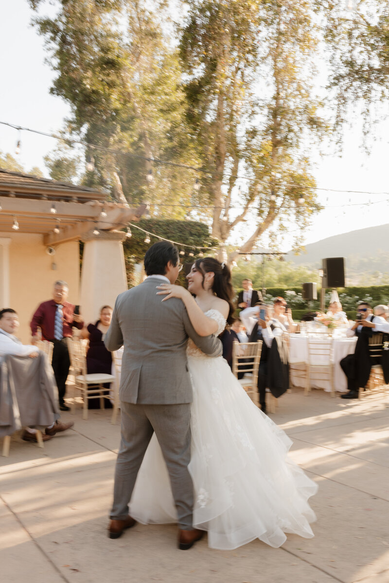 Blurry photo of a wedding couple during their first dance. 