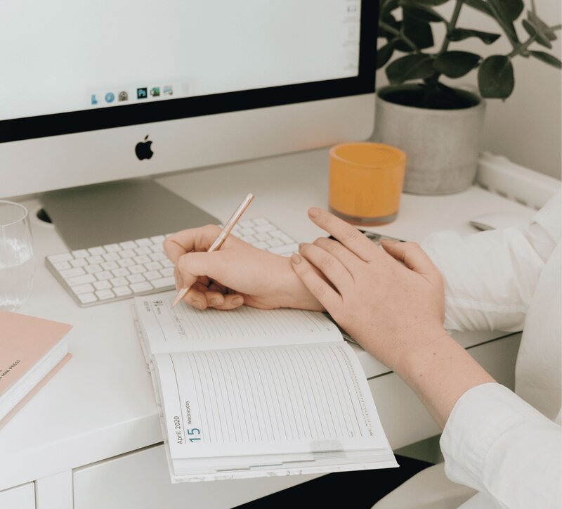 Woman Writing in Journal - Online Marketing Expert