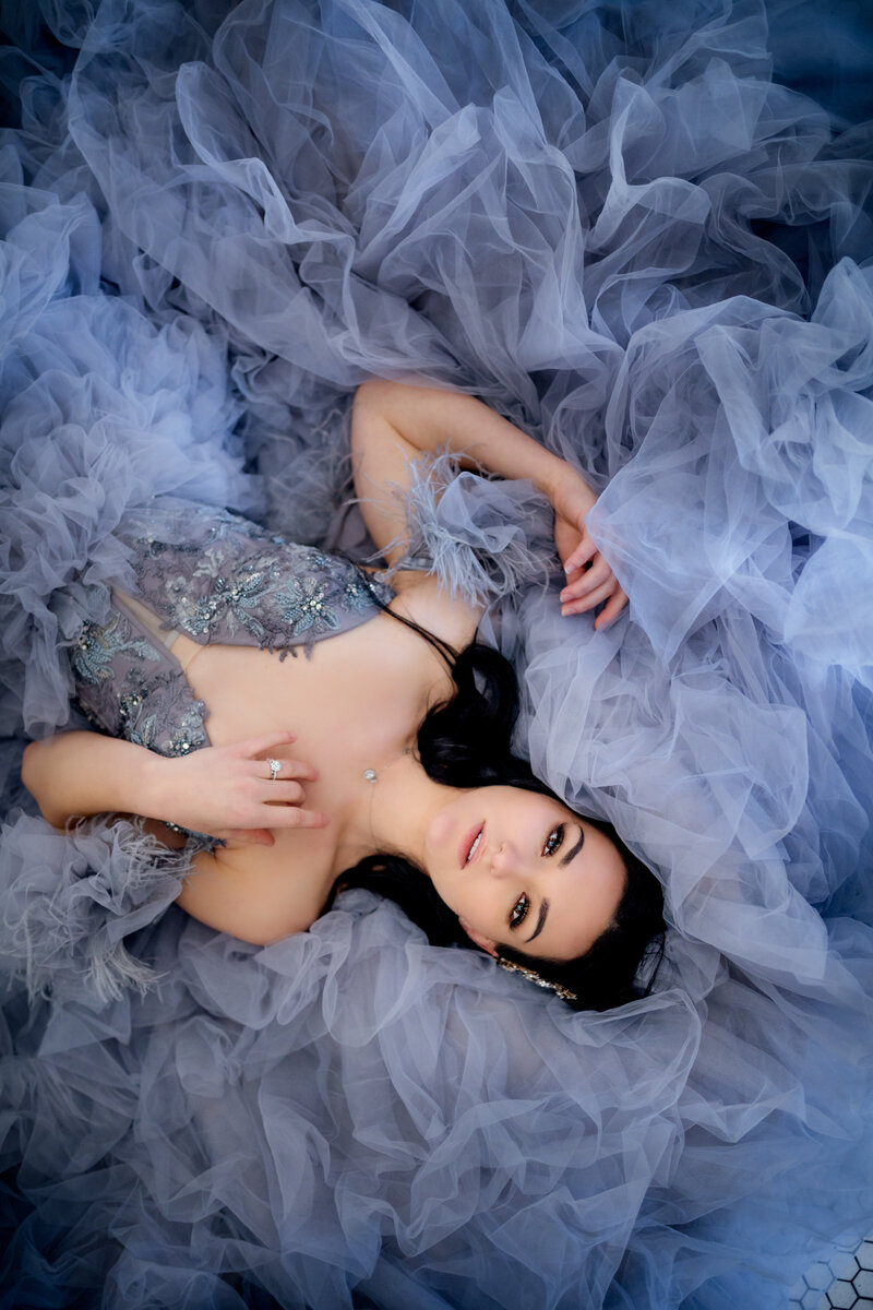 A dreamy indoor styled shoot featuring soft blue tones and elegant textures, designed for adventurous photographers seeking creative inspiration.