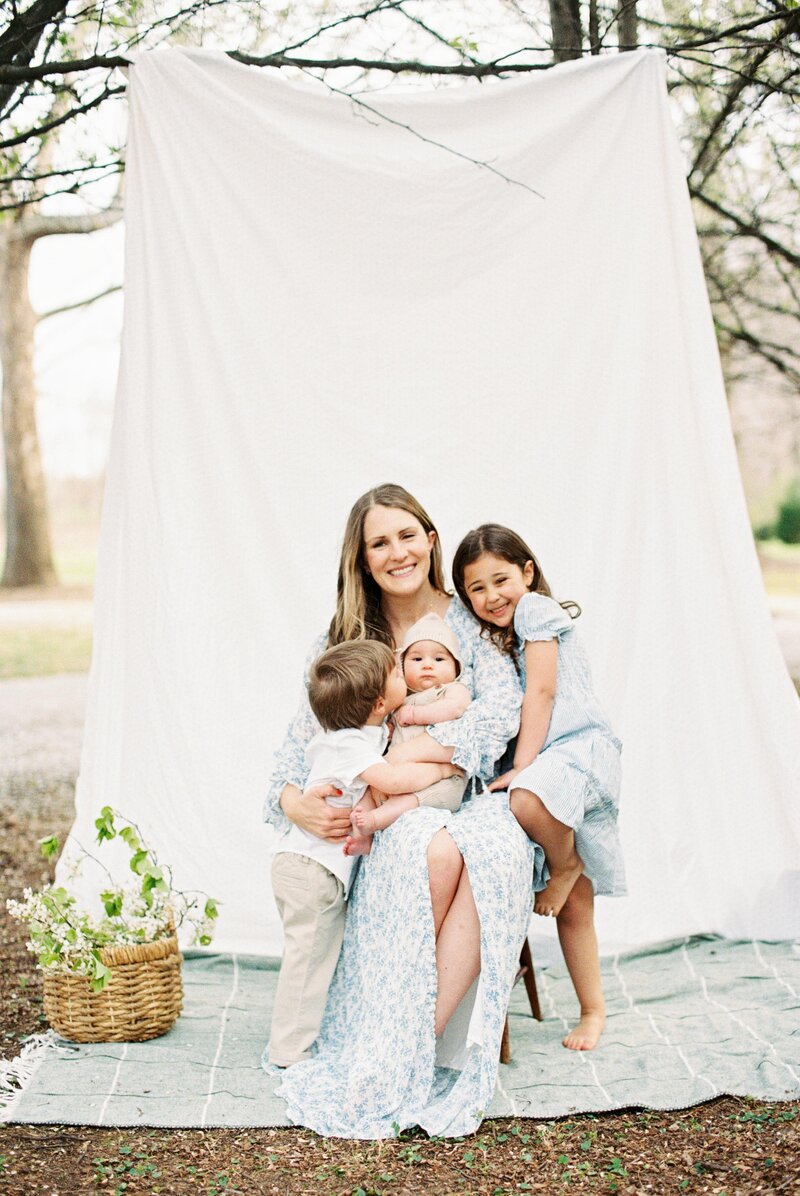 Kaitlin posing with her three kids
