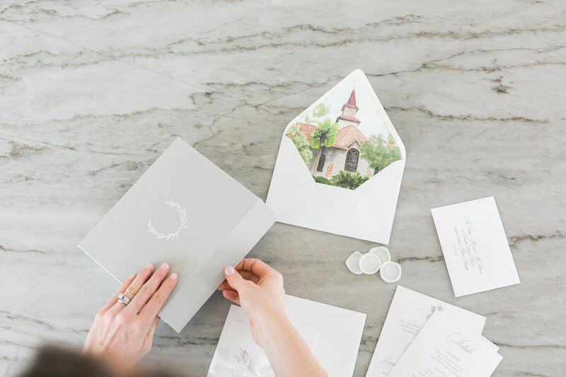 a painting of a wedding venue printed on an envelope liner