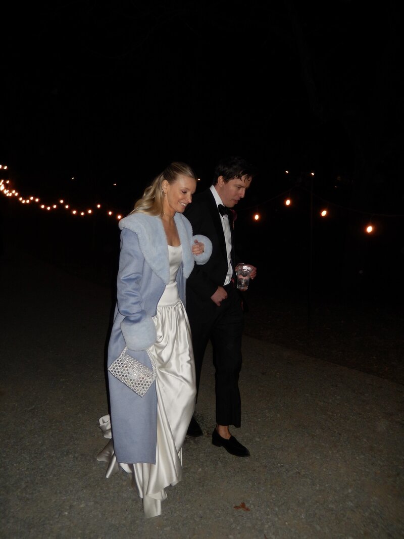Nicole walking arm in arm with her husband