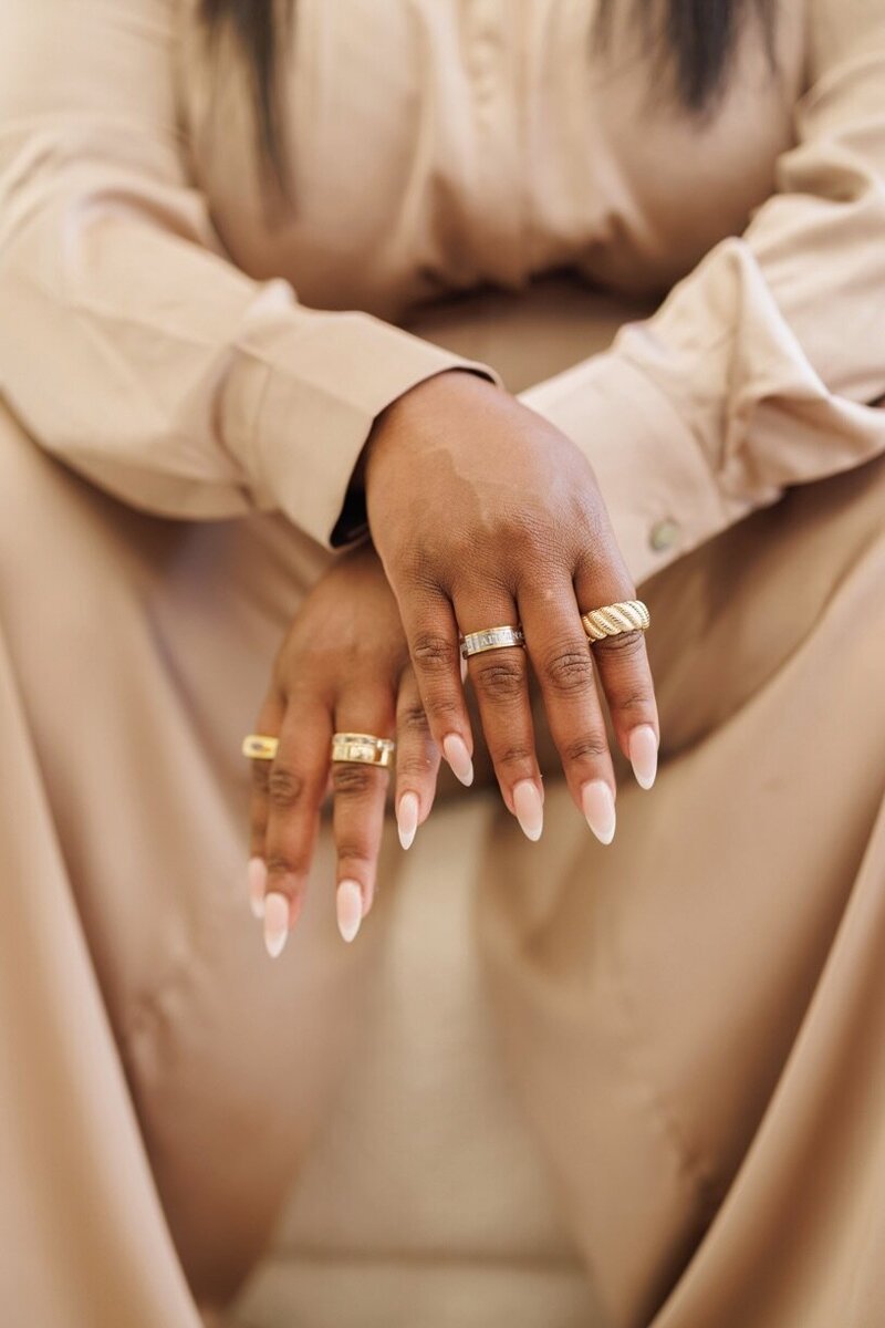 close up of hands crossed while sitting