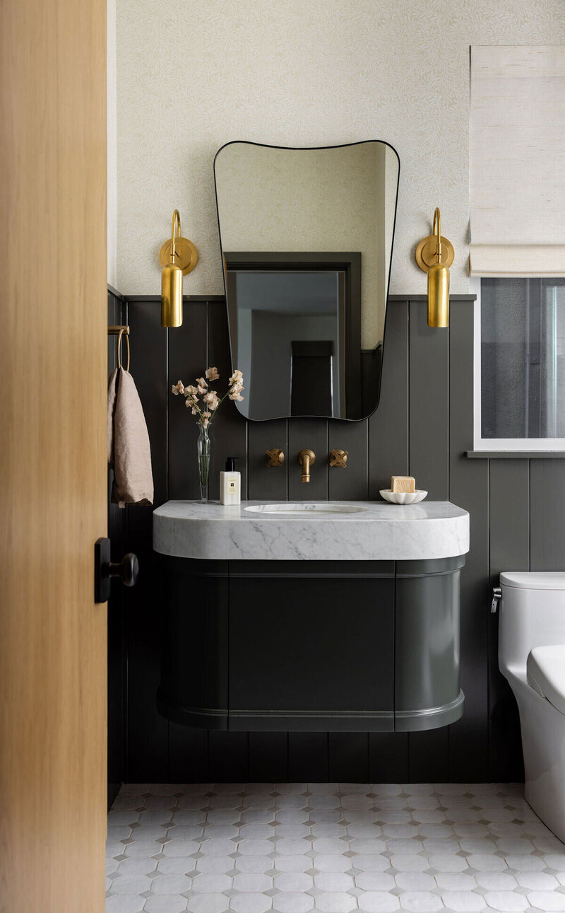 an example of our interior design approach, featuring a modern Bedroom Vignette with contrasting colors and funky mirror