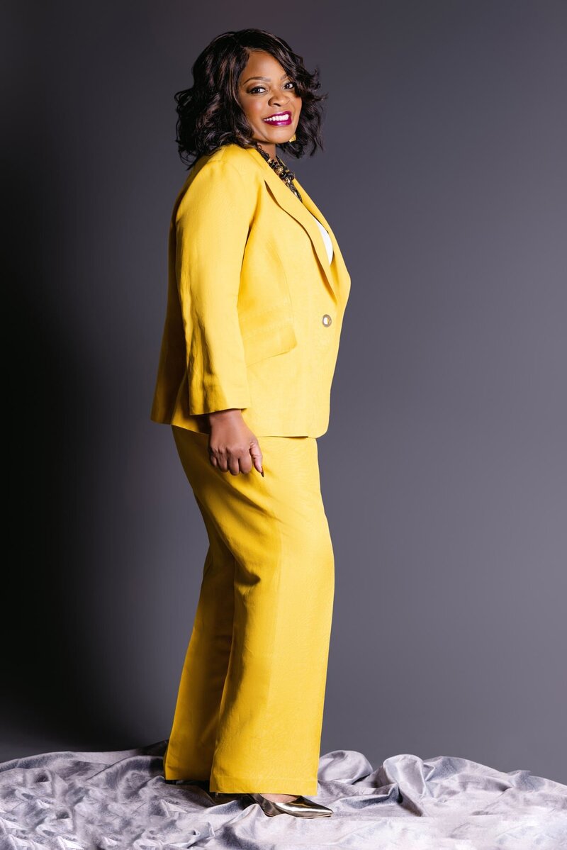 Woman in bright yellow suit