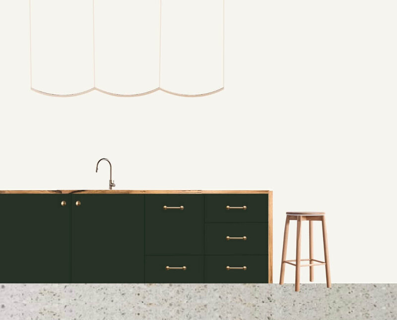 An dark green kitchen island bench, with touches of recycled wood and brass accents.