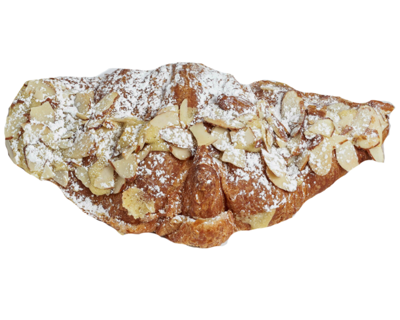 Almond croissant topped with powdered sugar and almond slices on a white plate, featured at Lyla's House in Georgetown, ON.