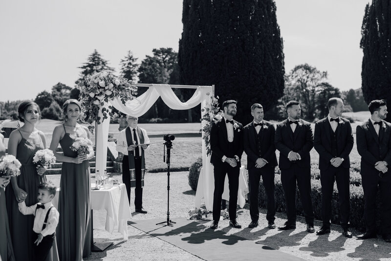 groom-waiting-for-bride-at-ceremony