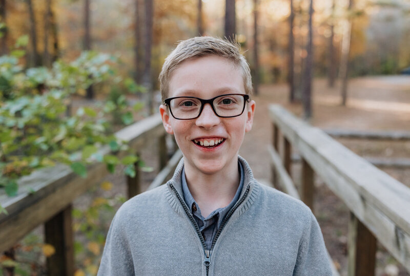 Close-up portrait of a boy smiling at the camera taken in Farmington, Missouri.