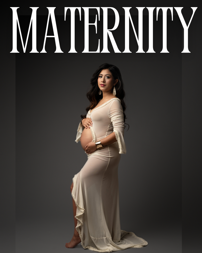 Pregnant woman glows during indoor maternity photo session.