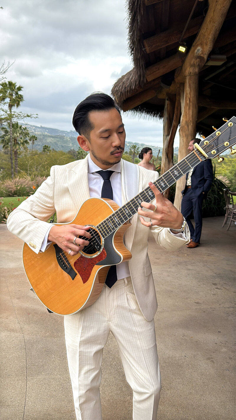 Moses Lin Music playing live guitar during cocktail hour at San Diego Safari Park San Diego Zoo Safari Park.