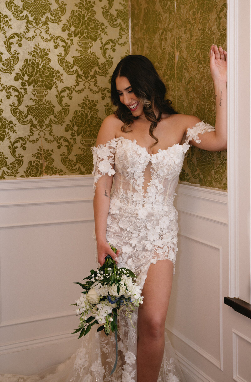 stunning bride modeling ahouse of bridal wedding gown at white hall mansion in brockport ny