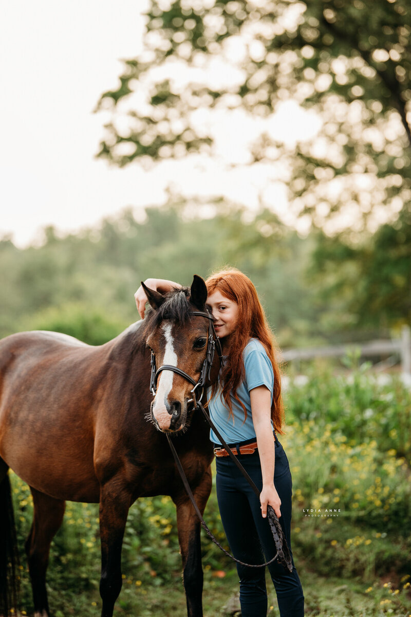 Let your love for horses shine through with a custom equestrian portrait session in Rochester, NY. Our professional photographers specialize in capturing the connection between rider and horse in stunning portraits that reflect the spirit of the equestrian lifestyle. Whether you prefer a quiet moment with your horse in a picturesque field, action shots as you ride through the countryside, or elegant portraits in a stable or barn setting, our sessions are tailored to your vision. Perfect for equestrian enthusiasts of all ages, these portraits make a lasting impression and serve as a beautiful reminder of the bond you share with your equine companion.