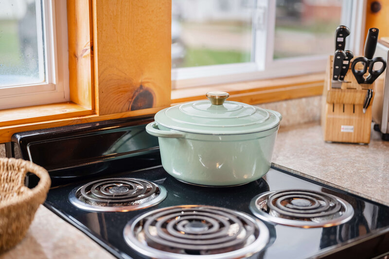 Gas stove with light blue pot