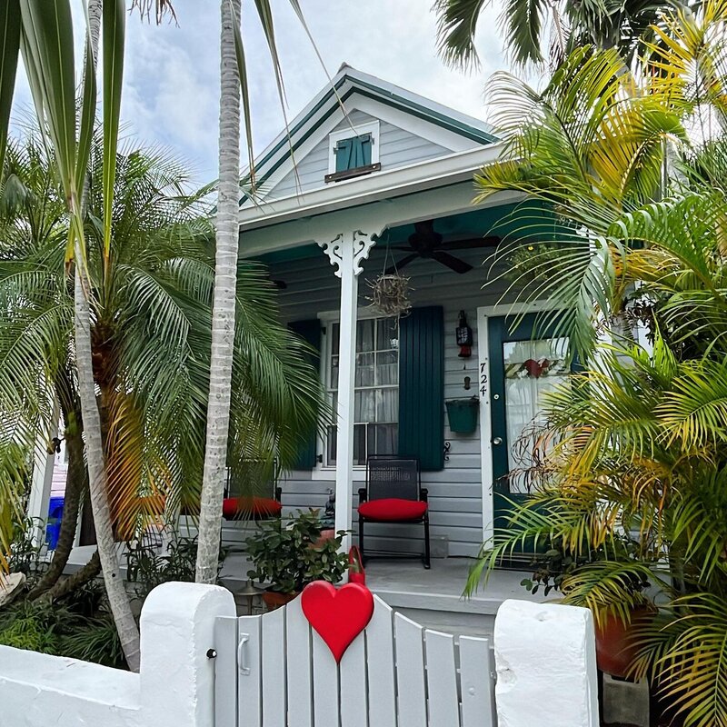 Colorful conch cottages and palm-lined street in Old Town Key West