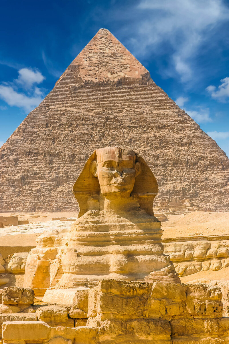 The Great Sphinx of Giza with the Pyramid of Khafre in the background, iconic landmarks in Egypt.