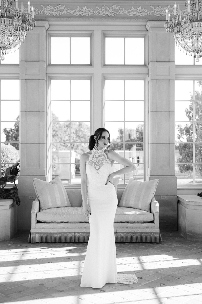 a bride posing in a sleek wedding dress