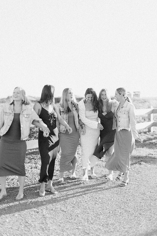 bridal party walking and laughing