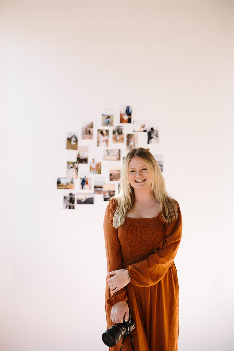 adventure elopement photographer displays prints from past ceremonies, surrounded by the stories she’s captured.