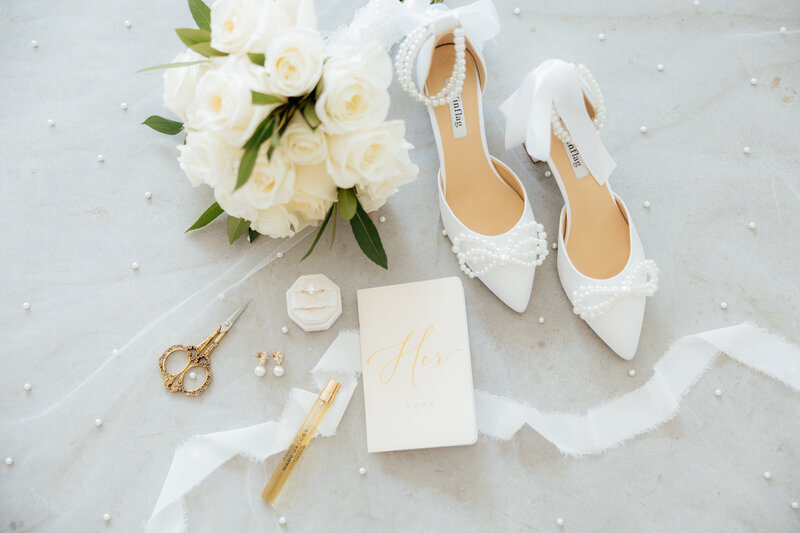A white pearl wedding flatlay.