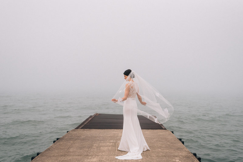 bride-at-elder-lane-beach-pier-winnetka
