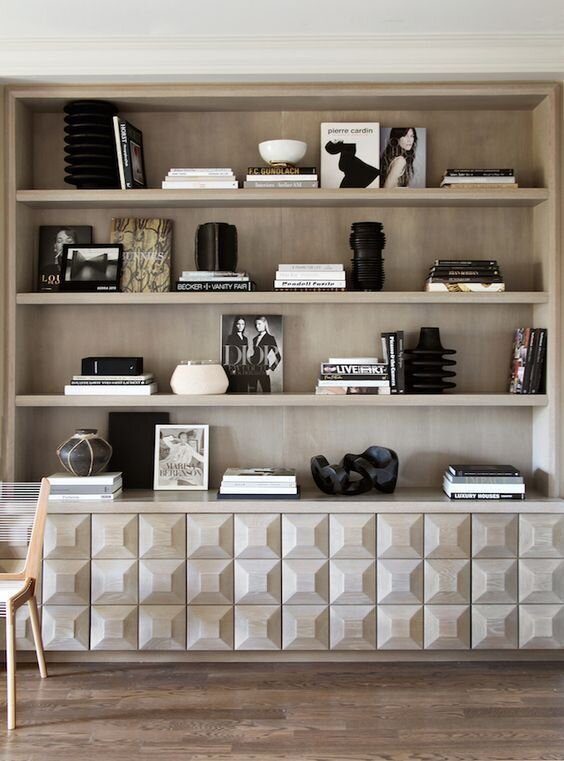 built in bookcase styled with simple modern books and decor