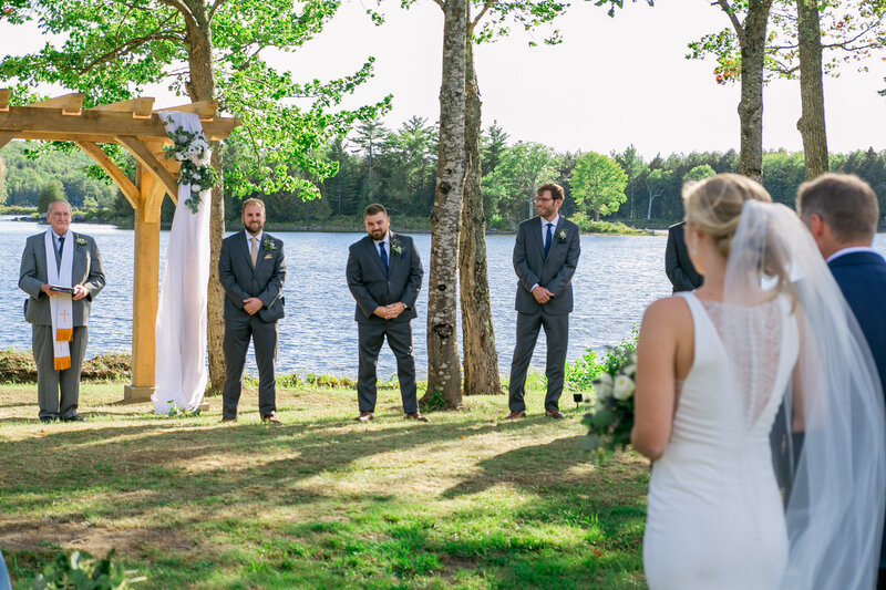 Bride walking down the aisle toward Groom | Klein Wedding at Grace on the Lake taken by Maine Photographer