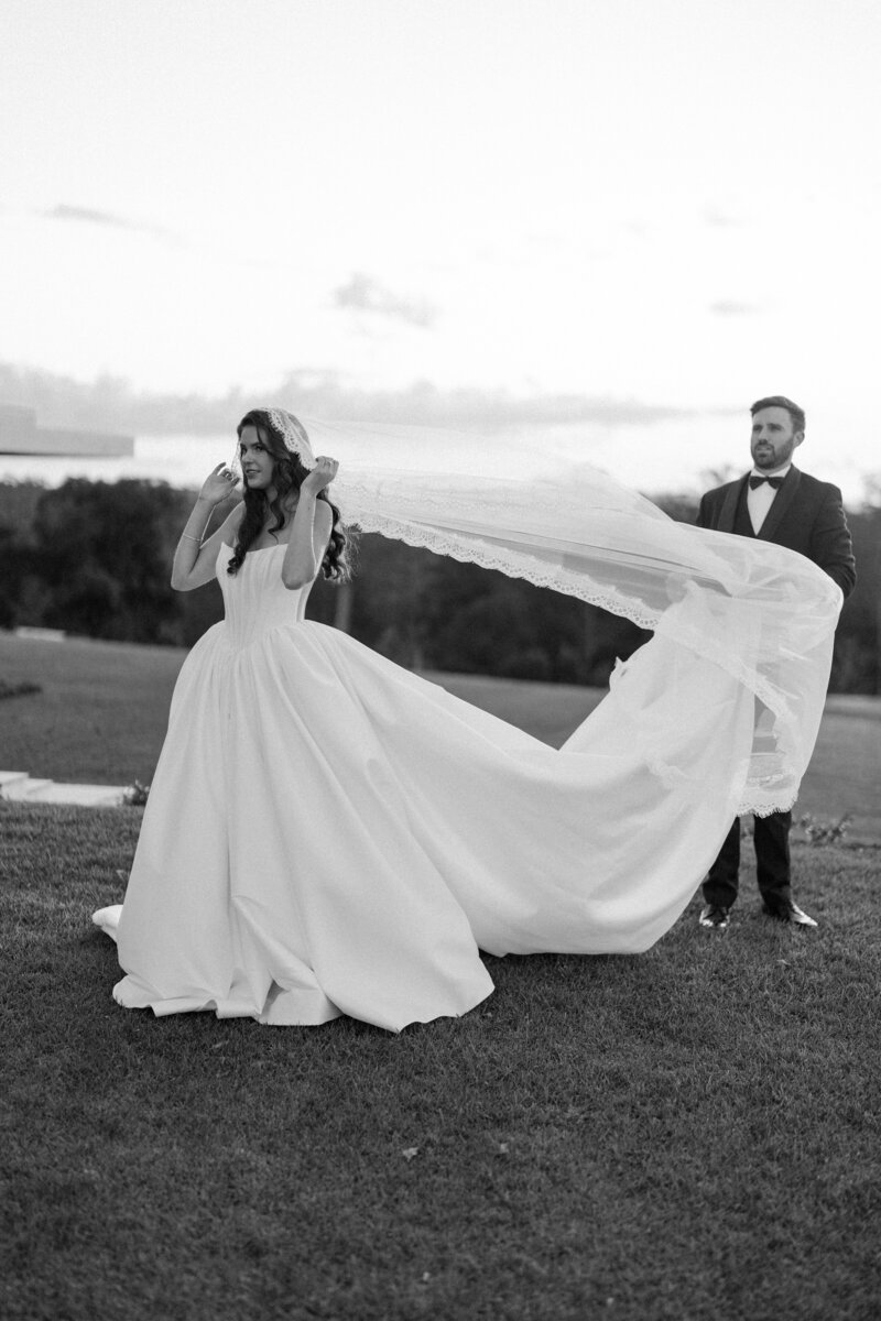 Bride + Groom talking a stroll at Gabbinbar Homestead