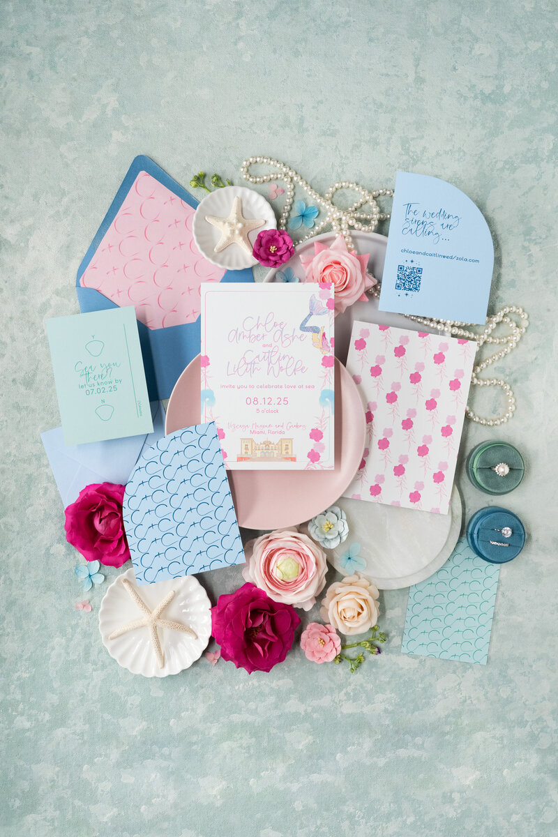 A retro themed wedding invitation suite with record place cards.