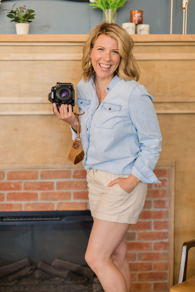 beautiful woman holding camera