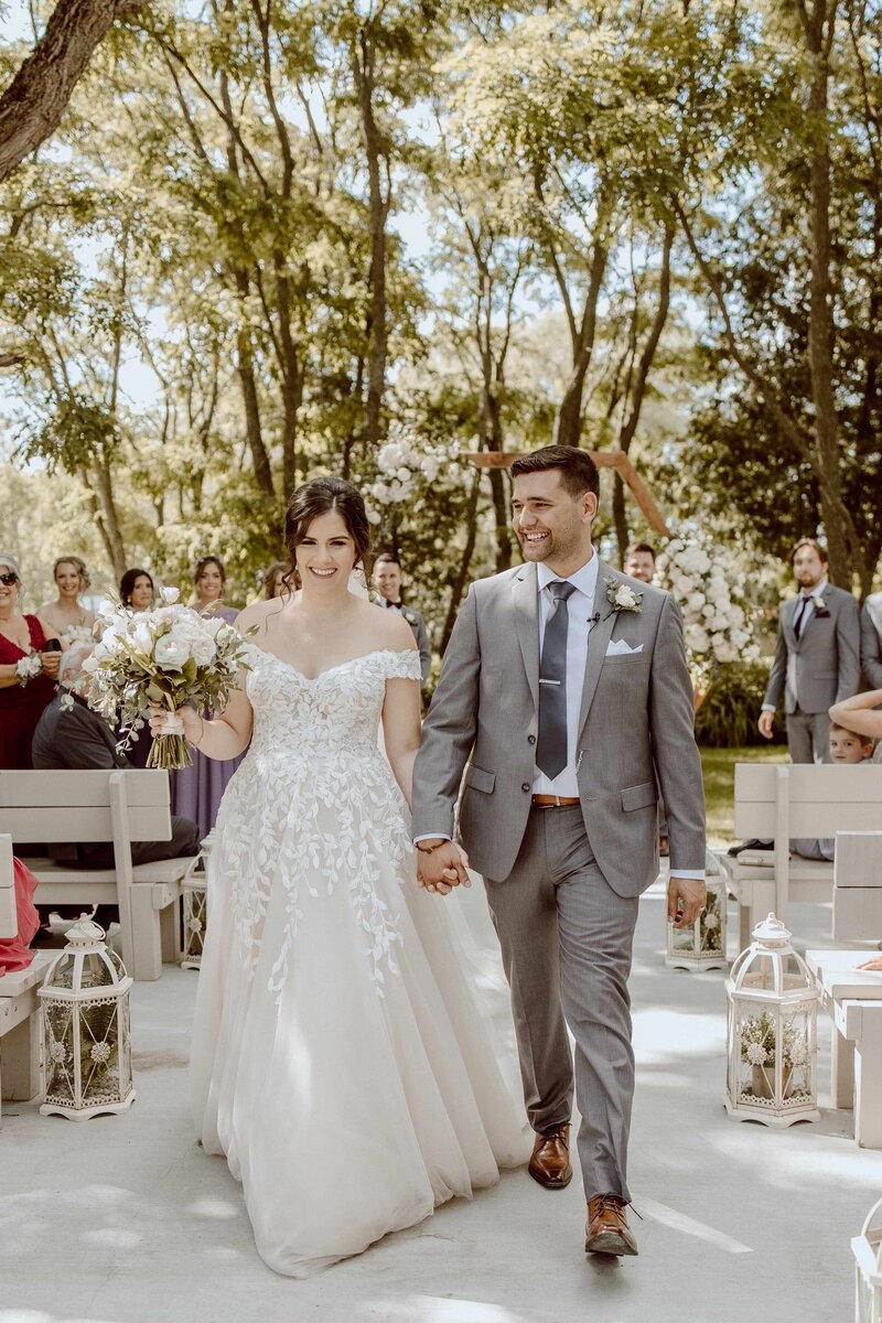 bride and groom walking ceremony recessional