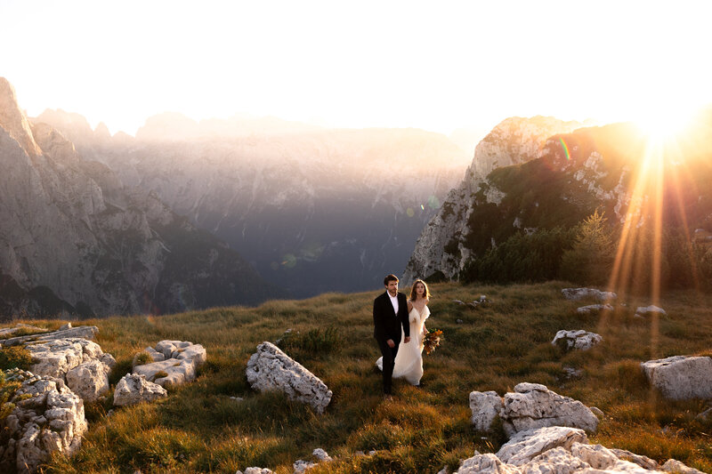elicopter elopement in the Dolomites, Italy – couple celebrating on a mountain peak adventure with Kollar Photography.