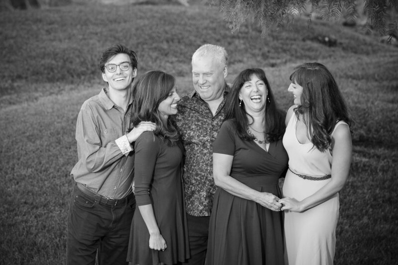 Black and white photo of a family smiling together