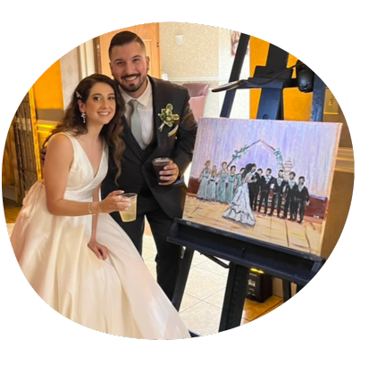 Happy newly wed couple with their live event painting