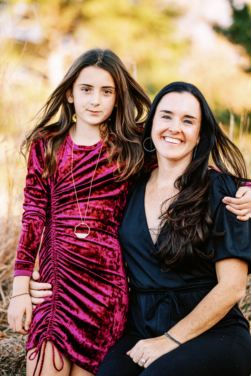 portrait of a mom and daughter in dressy clothing
