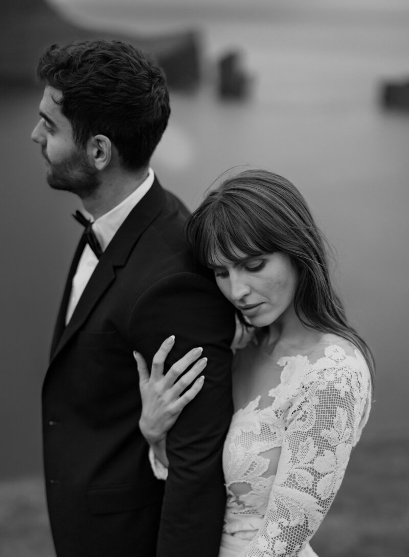 Faroe Islands elopement portraits – bride and groom laughing in the wind, by Kollar Photography.
