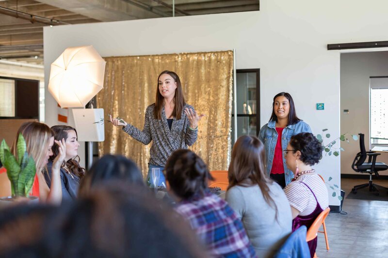 Elegant and professional branding events photography by Sophie K. Hunter featuring a female speaker at a corporate event in Dallas, TX.