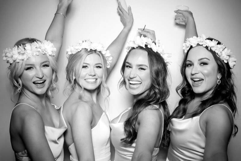 bridesmaids smiling for photo booth