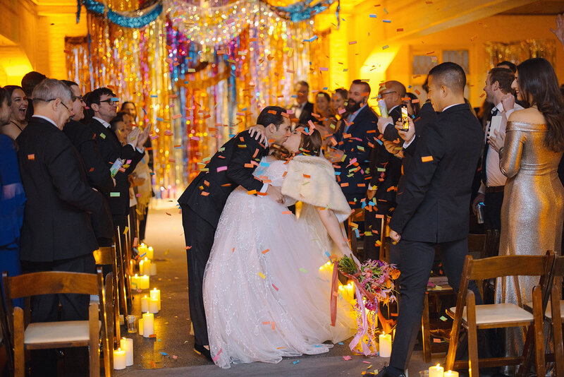 Two people floating in water in bumper boats.