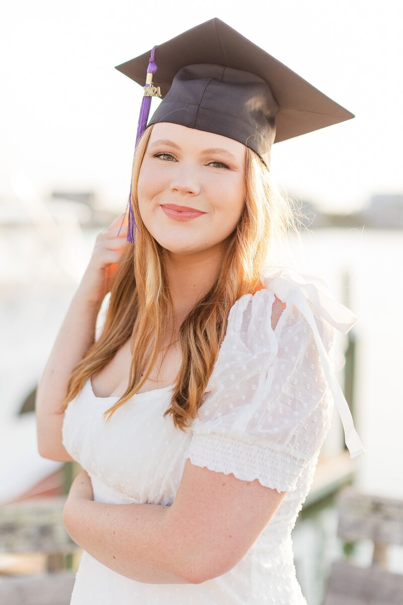 Girl in a grad cap with a purple tassel