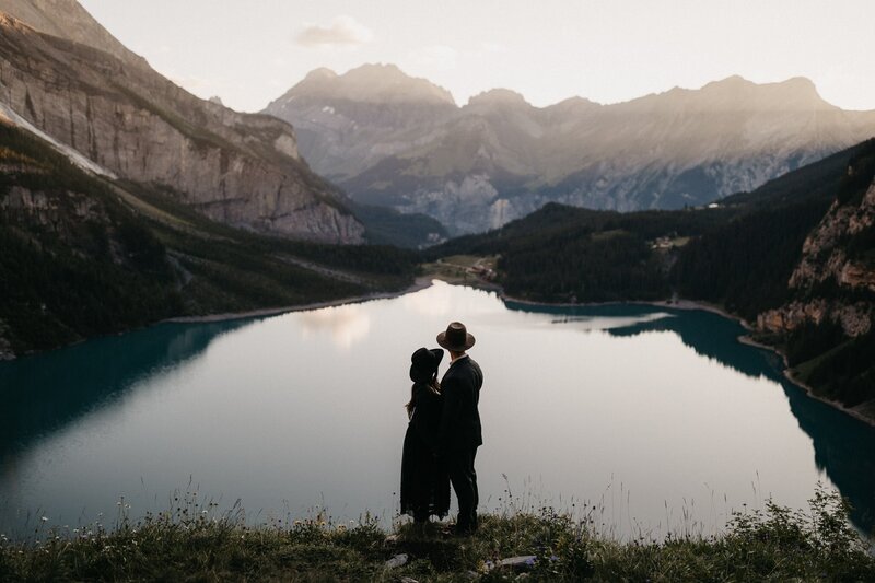 A couple embracing in front of a beautiful lake in Italy
