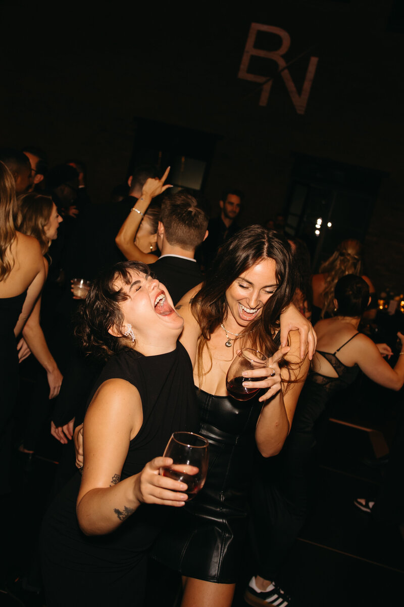 man rips shirt on wedding dance floor