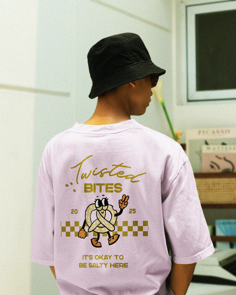 Custom apparel and merchandise design for a pretzel brand – Twisted Bites’ apparel and merchandise feature the brand’s signature retro aesthetic and playful illustrations. From t-shirts to tote bags, these designs bring the brand to life beyond the bakery.