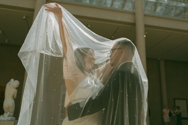 bride and groom posing at the met before eloping shot by Elsie Goodman Photography | NYC Elopement Packages